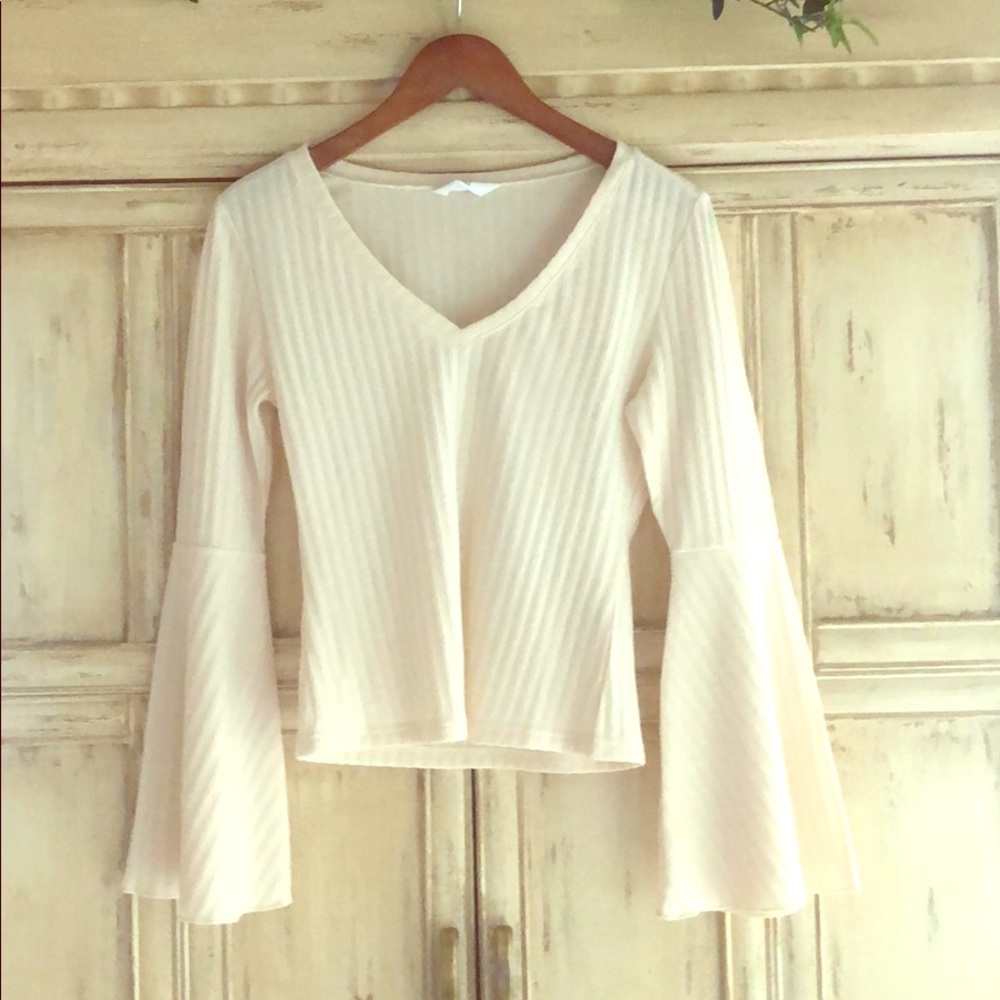 Top with v-neck and bell sleeves